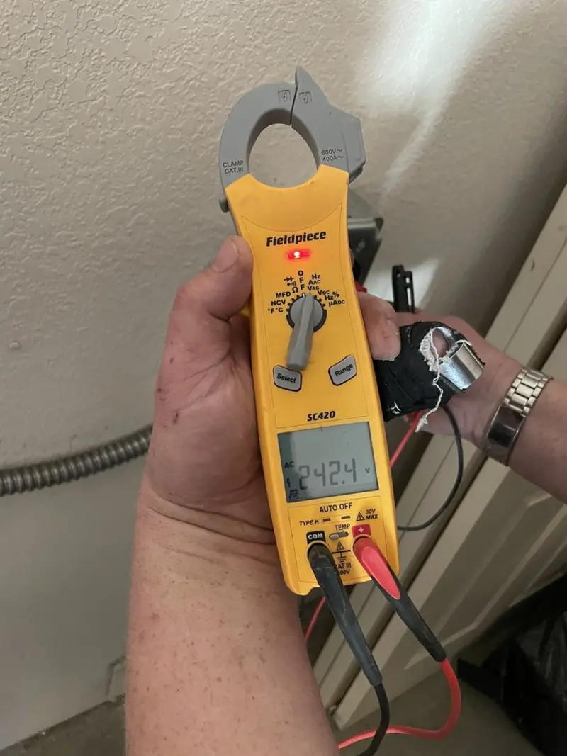 Voltage testing with clamp meter during Electrical Installation Services in West Columbia